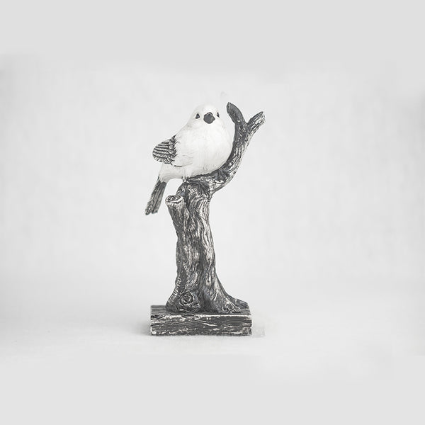 One bird on tree sculpture